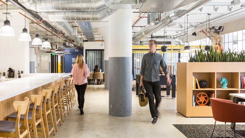 People walking in a designer coworking space